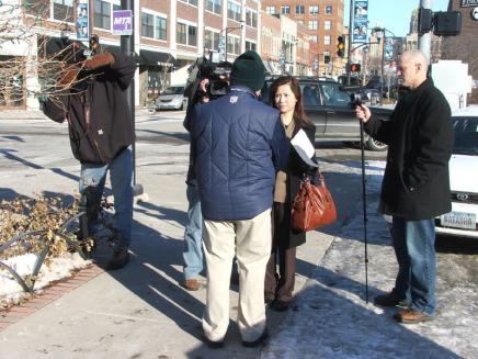 Roger Routh on the sidewalk with an international news organization
