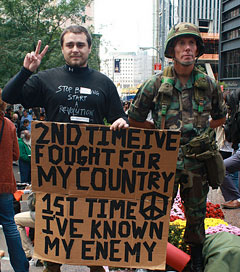 The man on the left served with the Marines in Southern Afghanistan from 2001-2006. The man on the right is now a public school teacher.