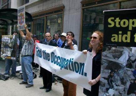 Solidarity activists protest outside Caterpillar's annual shareholder meeting in Chicago, 9 June. (Kristin Szremski)