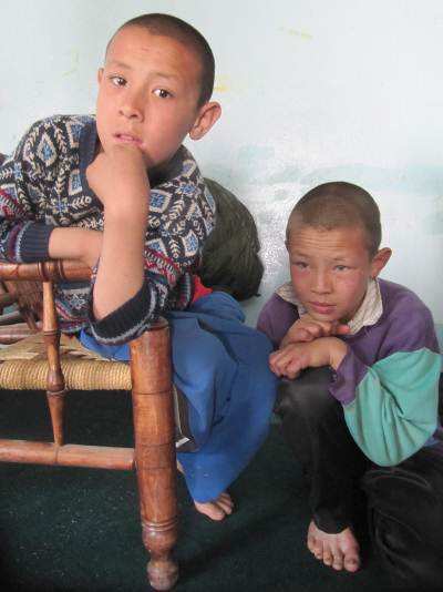 Two Afghan youth taking refuge together with the Afghan Peace Volunteers