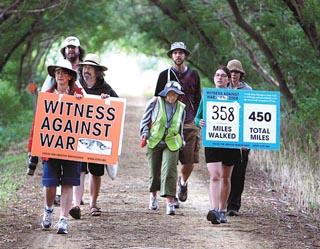 Witness Against War - LaCrosse: A group of protesters walk the bike trail from Bangor,Wi. to West Salem Tuesday morning as part of their walk acrosse Wisconsin to protest the war in Iraq. Dick Riniker photo