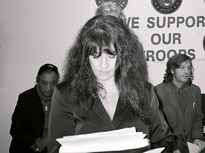 Elaine Brower of Great Kills reads a letter from a constituent (Devra Morice / Next Left Notes)