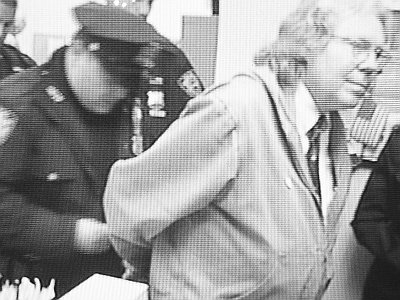 Tom Good, a Silver Lake resident, is cuffed (Brian Kelly / Next Left Notes)