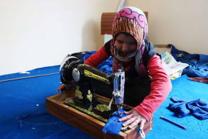 Sakina with sewing machine